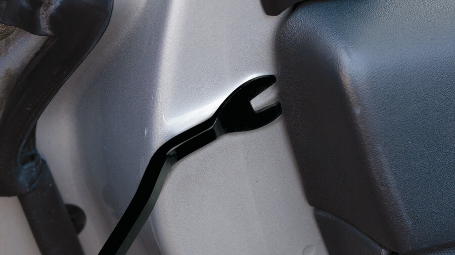 Performance Tool automotive hardware kits, featuring an image of a push pin applicator in use to access a push pin placement for care interiors and exteriors.