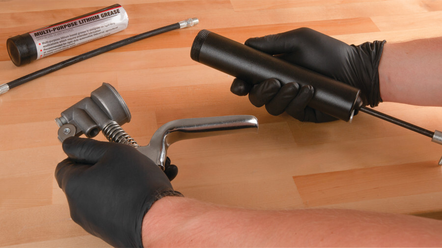 Performance Tool grease gun accessories, featuring an image of a disassembled lever grease gun being put together for use by loading grease