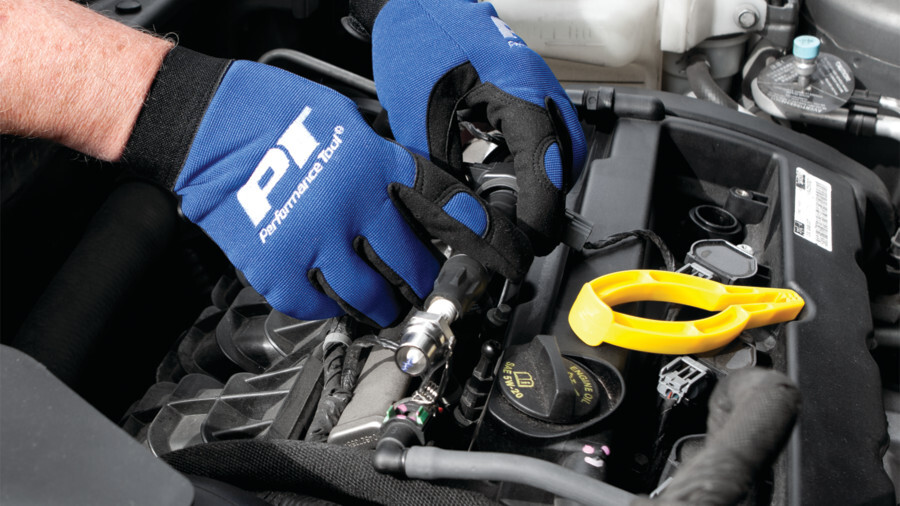 Performance Tool Fuel and Ignition Tools. Featuring an image of a spark plug wire puller being used on an engine.
