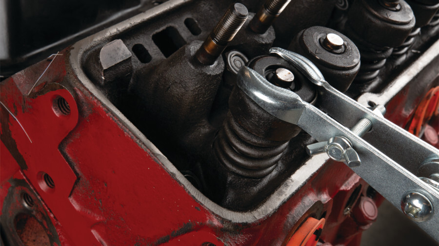 Performance Tool valve and spring tools. Features an image of a Valve Spring Compressor in use.