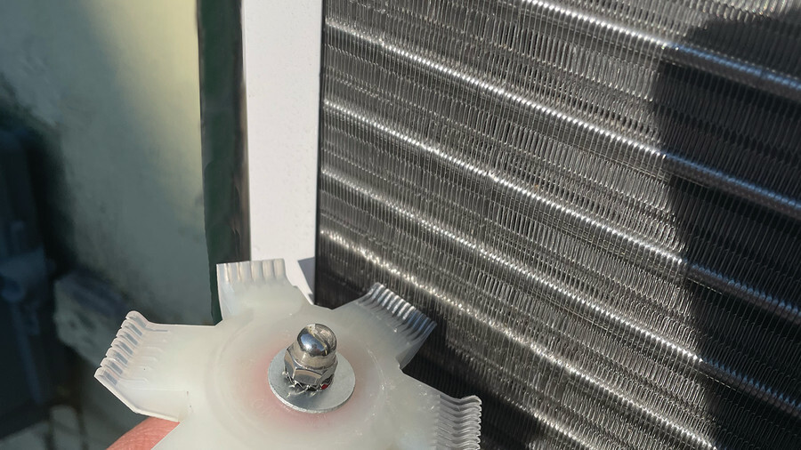 Performance Tool Cooling Tools. Featuring an image of a radiator fan straightener in use.