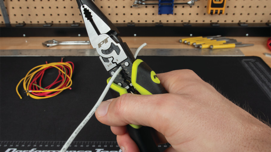 Performance Tool crimpers and strippers, featuring an image of a set of electrical linesman pliers being used to strip a wire on a workbench