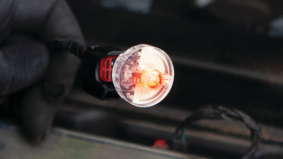 Performance Tool fuel tools including a picture of a Noid Test Light operating in a handed glove.