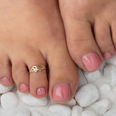 Yellow Gold Butterfly Rope Toe Ring on female model