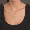 Yellow Gold Scorpion Symbol of Power Pendant Necklace on a Female Model