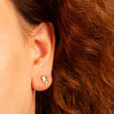 Yellow Gold Flower Daisy Stud Earrings on female model