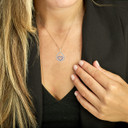 Gold Diamond and Sapphire Teardrop Eternity Heart Pendant Necklace on a Female Model