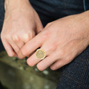 Yellow Gold Ancient Aztec Mayan Sun Calendar Statement Round Signet Ring on male model