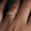 14K Yellow Gold Oval CZ Rope Twisted Band Ring on female model