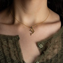 Gold Textured Dolphin Ocean Pendant Necklace on female model