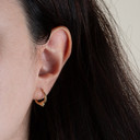 14K Reversible Heart Hoop Earrings on female model