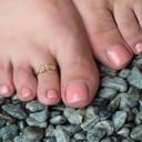 Yellow Gold Hawaiian Plumeria Flower Toe Ring on female model