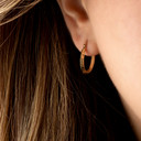 14K Yellow Gold Reversible Horseshoe Hoop Earrings on female model