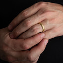Yellow Gold Irish Celtic Trinity Knot Eternity Unisex Band Ring on male model