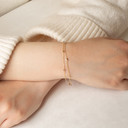 Tri-Color Gold Tube Link Bracelet on female model