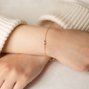 Yellow Gold Oval Link Eternity Bracelet on female model