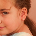 Yellow Gold Diamond Star Baby Stud Earrings on model