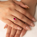Yellow Gold Personalized Halo Ruby Birthstone Ring on female model