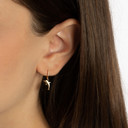 Yellow Gold Sea Dolphin Drop Huggie Hoop Earrings on female model