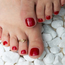 Gold Woman's Symbolic Snake Toe Ring on female model