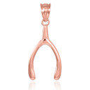 Wishbone pendant in rose gold.