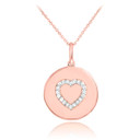 Heart disc pendant necklace with diamonds in 14k rose gold.