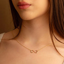 Dainty Infinity Necklace in 14K Yellow Gold on female model