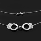 Handcuffs necklace with diamond accents in 14k white gold.