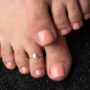 Yellow Gold Woman's Footsteps of Life Toe Ring on female model