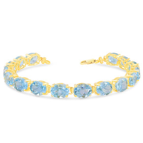 Oval Genuine Blue Topaz (9 x 7) Tennis Bracelet in Yellow Gold