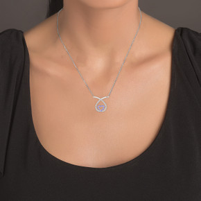 White Gold Diamond and Sapphire Teardrop Eternity Heart Necklace on a Model