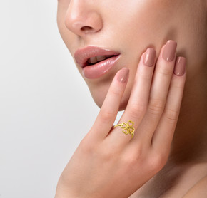 Yellow Gold Four Leaf Heart Clover Ring on female model