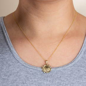 Gold Celestial Sun Face Pendant Necklace on female model