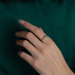 Yellow Gold Diamond Halo Circle Ring on female model