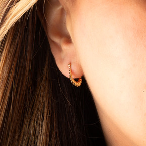 14K Yellow Gold Reversible Ribbed Croissant Hoop Earrings on female model