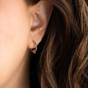 14K White Gold Heart Reversible Hoop Earrings on female model