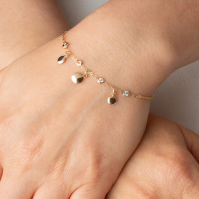 Yellow Gold Cubic Zirconia Circle Charm Bracelet on female model