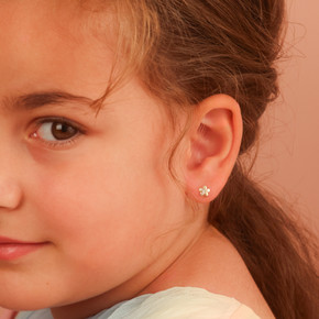 Yellow Gold Diamond Flower Baby Stud Earrings on female model