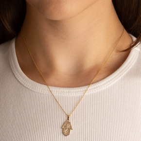 Two-Tone Yellow/White Gold Hamsa Hand Evil Eye Of Protection Diamond Cut Pendant Necklace on female model