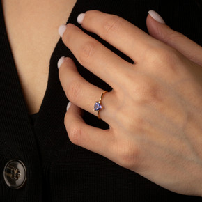 Yellow Gold Trillion Cut Tanzanite Gemstone Ring on female model