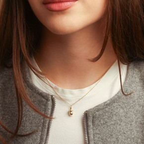 14K Gold Pacifier Baby Necklace on female model