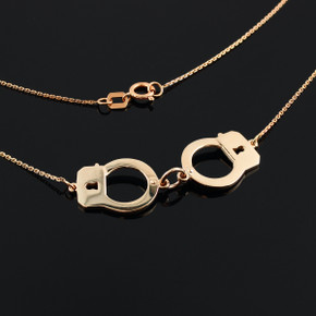 Handcuffs necklace in 14k rose gold.