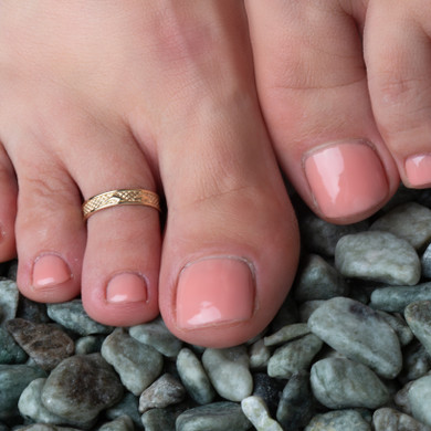 Yellow Gold Marine Dolphin Toe Ring on female model