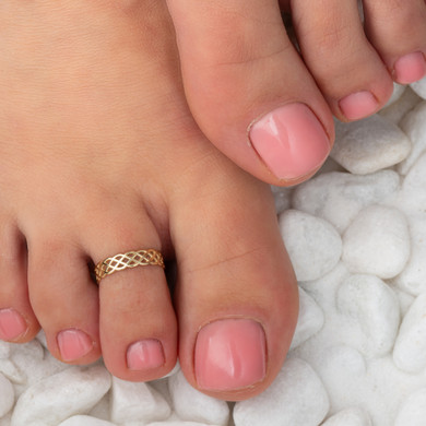 Gold Woman's Symbolic Trinity Knot Toe Ring on female model