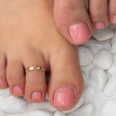 Gold Woman's Token of Love Heart Toe Ring on female model
