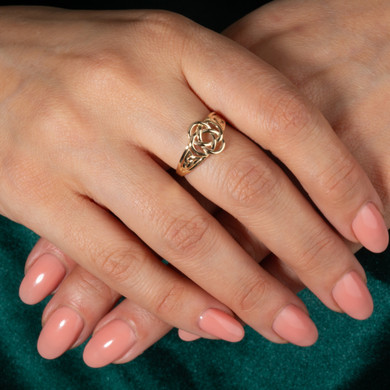 Gold Woman's Symbolic Dara Knot Trinity Ring on female model