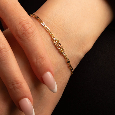 14K Tri-Color Gold 7" Quinceañera 15 Años Flower Figaro Chain Bracelet with Cubic Zirconia on female model