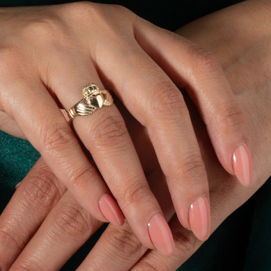 Gold Woman's Eternal Irish Claddagh Ring on female model