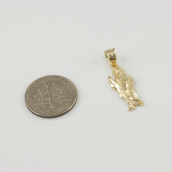 Solid Yellow Gold San Judas Pendant next to dime