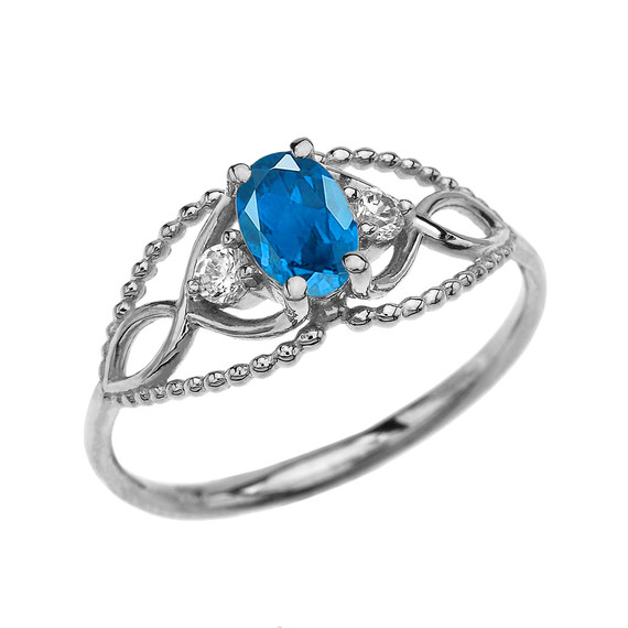 Elegant Beaded Solitaire Ring With Blue Topaz Centerstone and White Topaz in White Gold